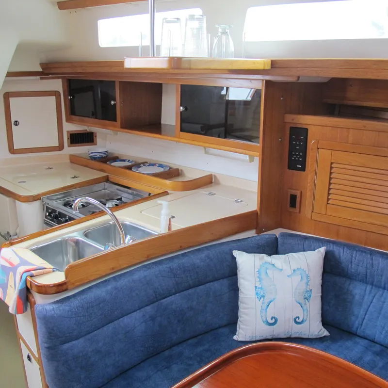 Slide: The Image of Interior of 1999 Catalina 42 MkII yacht with cozy seating and modern kitchen. - 25