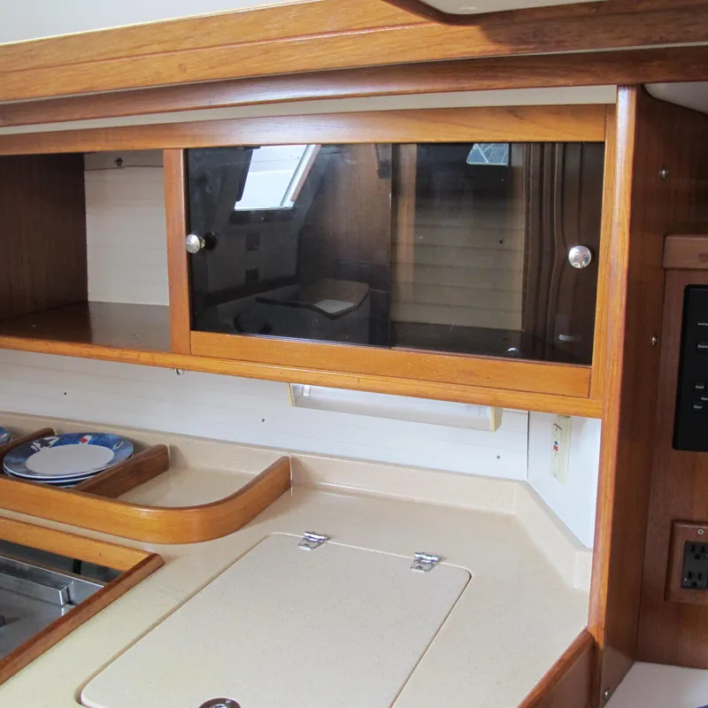 Slide: The Image of Interior of 1999 Catalina 42 MkII yacht with wooden cabinets and countertop. - 30
