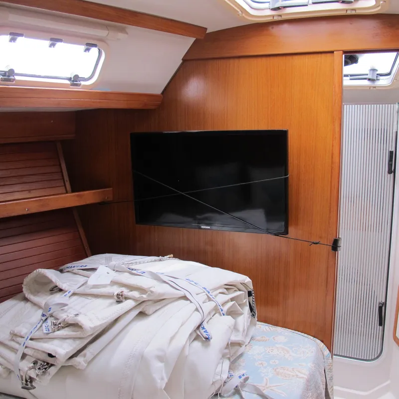 Slide: The Image of Interior of 1999 Catalina 42 MkII sailboat with TV and folded sails. - 35