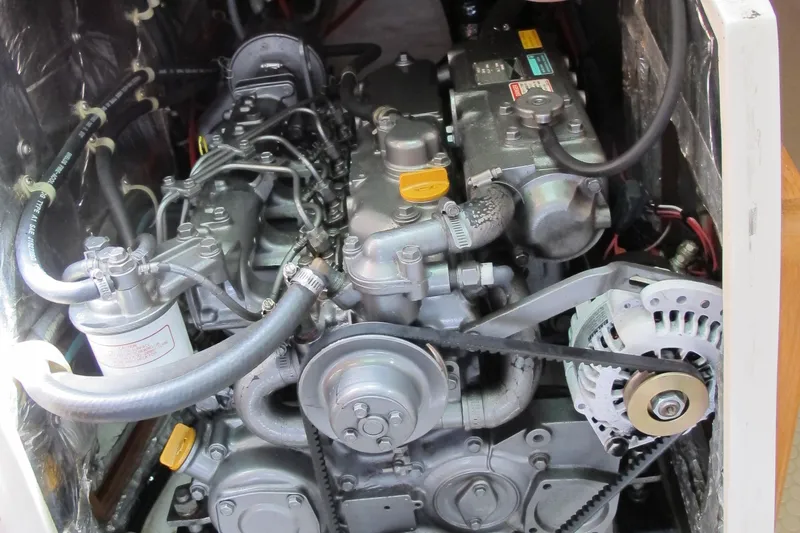 Slide: The Image of Engine compartment of a 1999 Catalina 42 MkII sailboat, showcasing mechanical components. - 45