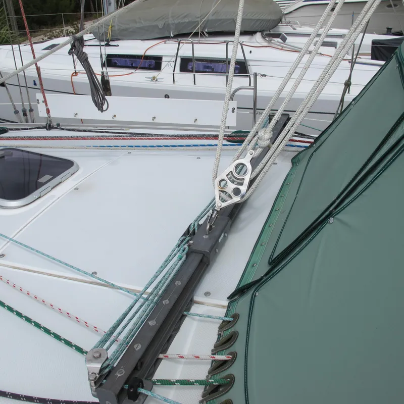 Slide: The Image of Deck view of a 1999 Catalina 42 MkII sailboat with rigging and ropes. - 5