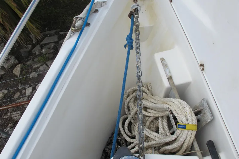 Slide: The Image of Anchor locker of a 1999 Catalina 42 MkII sailboat with ropes and chain. - 8