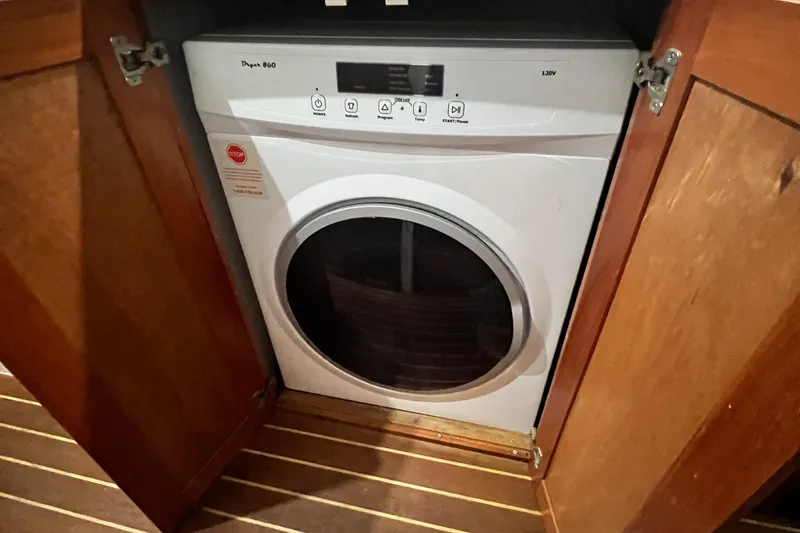 Slide: The Image of Washing machine inside wooden cabinet on 2007 Great Harbour N47 yacht. - 14