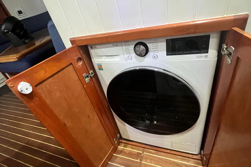 Slide: The Image of Washer-dryer unit in 2007 Great Harbour N47 yacht's wooden cabinet. - 15