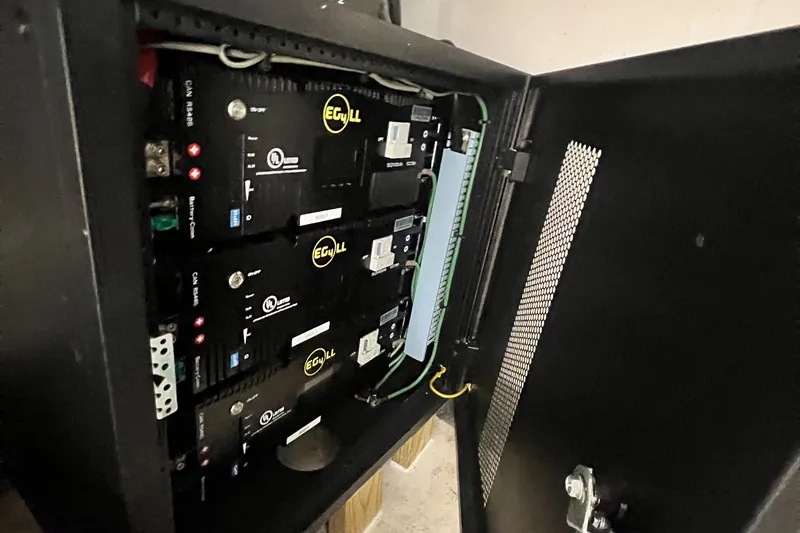 Slide: The Image of Electrical panel inside a Great Harbour N47 yacht, 2007 model, showcasing wiring and components. - 17