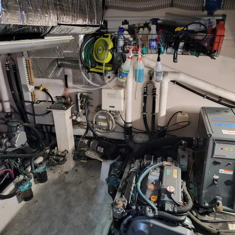 Slide: The Image of Engine room of a 2007 Great Harbour N47 yacht with various mechanical components. - 4
