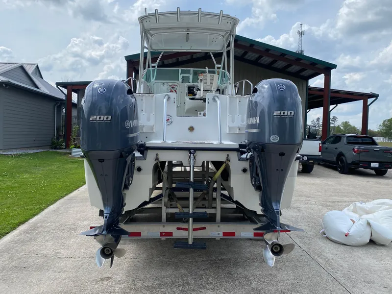 Slide: The Image of 2001 Glacier Bay 2670 Island Runner boat with dual Yamaha 200 engines on a trailer. - 13