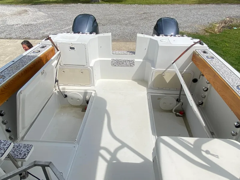 Slide: The Image of 2001 Glacier Bay 2670 Island Runner boat interior with dual engines and seating area. - 4