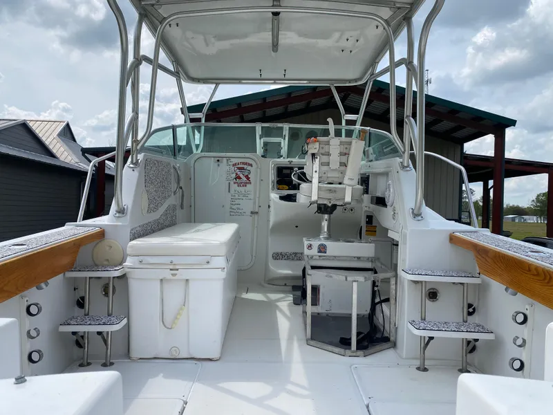 Slide: The Image of 2001 Glacier Bay 2670 Island Runner boat interior with seating and helm station. - 6