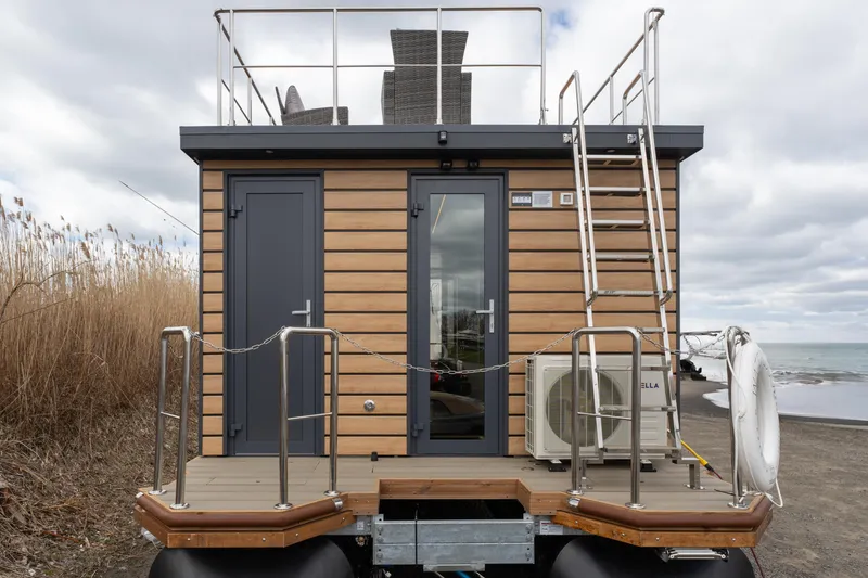 Slide: The Image of 2024 Waterlodge Apart M houseboat with rooftop deck, wooden exterior, and modern design. - 41