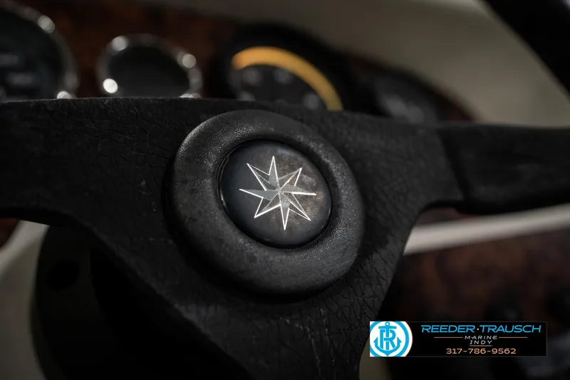 Slide: The Image of Steering wheel of 1998 Odyssey 25 with star emblem, dashboard in background. - 31