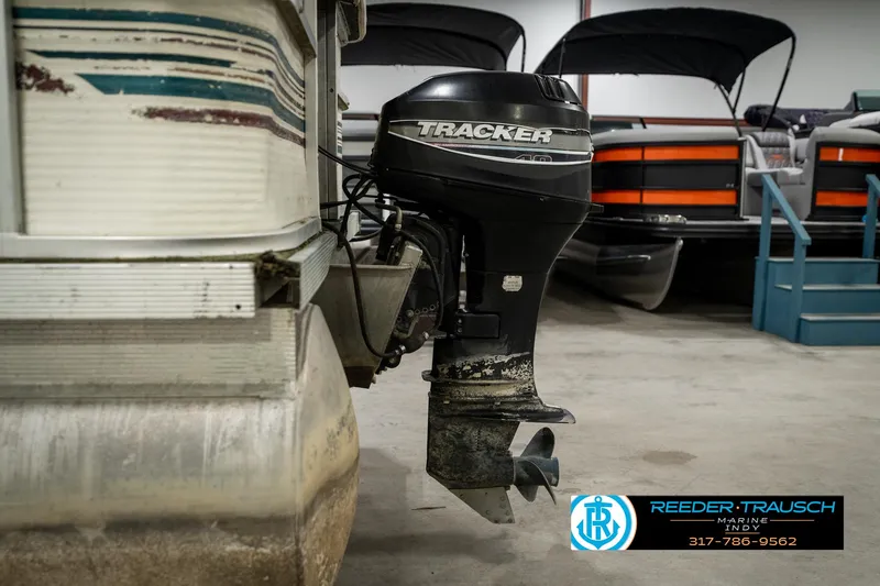 Slide: The Image of 1998 Odyssey 25 boat with Tracker outboard motor in storage facility. - 39