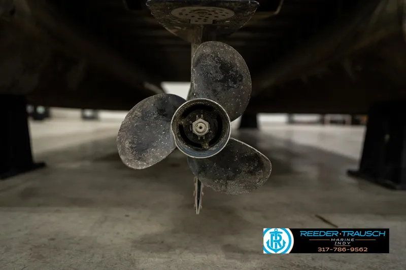 Slide: The Image of Propeller of 1998 Odyssey 25 boat in a workshop setting. - 41