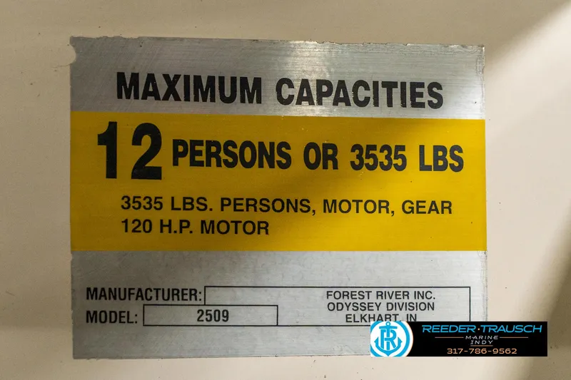 Slide: The Image of Capacity label for Odyssey 25, 1998: 12 persons or 3535 lbs, 120 HP motor. - 44