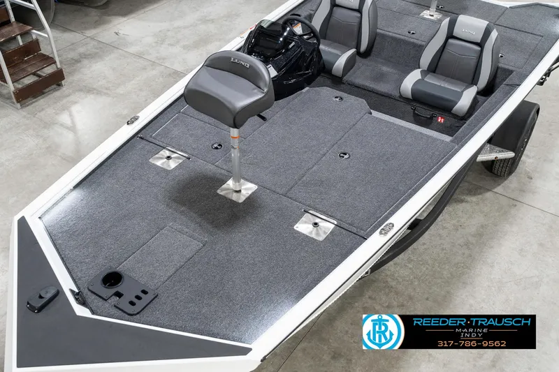 Slide: The Image of 2025 Lund 1775 Renegade boat interior with seating and storage compartments. - 10