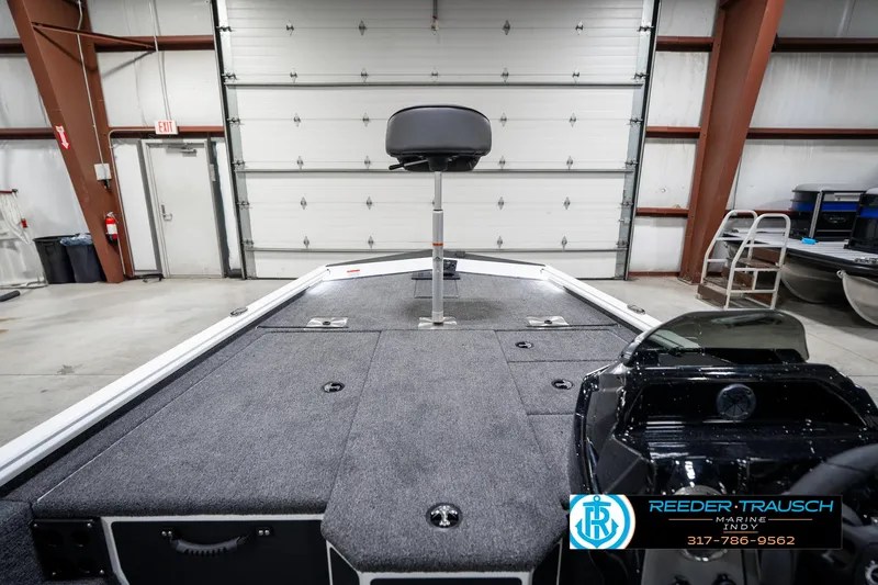 Slide: The Image of 2025 Lund 1775 Renegade boat interior in a garage setting. - 23