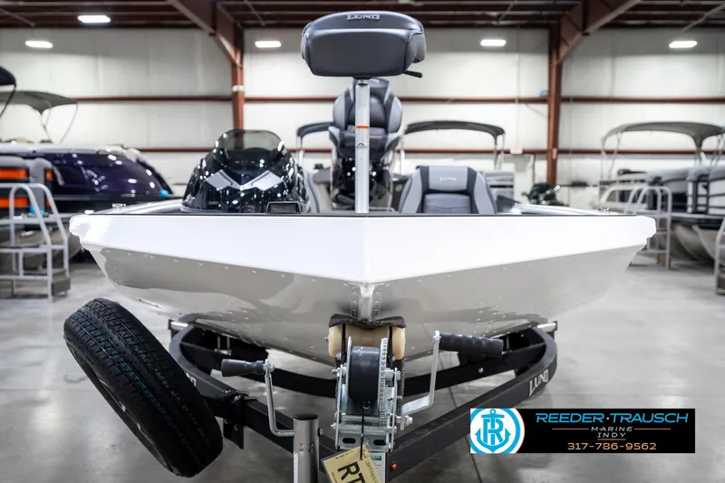 Slide: The Image of 2025 Lund 1775 Renegade boat on trailer in showroom, Reeder-Trausch Marine. - 3