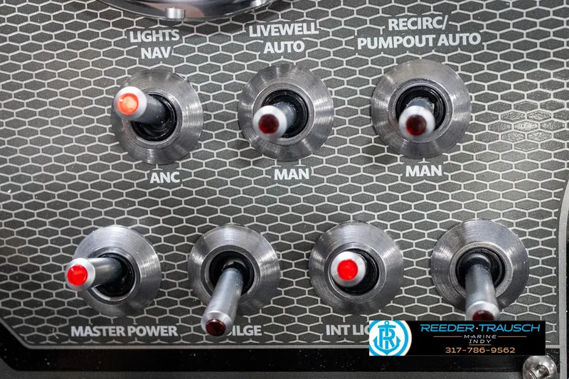 Slide: The Image of Control panel of 2025 Lund 1775 Renegade boat with various switches and labels. - 34