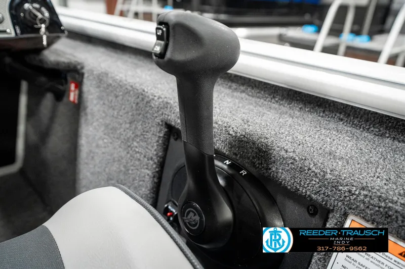 Slide: The Image of 2025 Lund 1775 Renegade boat throttle control in cockpit, close-up view. - 35