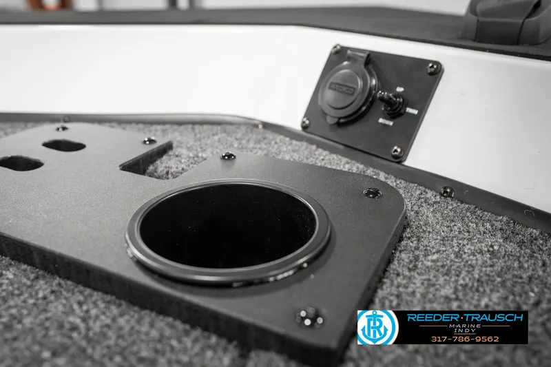 Slide: The Image of 2025 Lund 1775 Renegade boat interior with cup holder and control panel. - 38