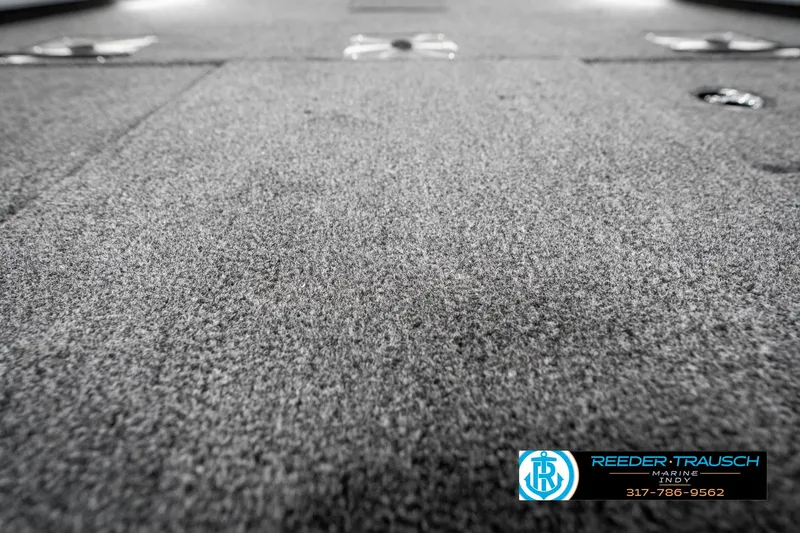 Slide: The Image of 2025 Lund 1775 Renegade boat deck with textured surface, Reeder-Trausch branding visible. - 40