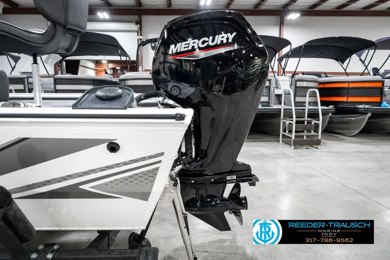 Slide: The Image of 2025 Lund 1775 Renegade boat with Mercury outboard motor in showroom. - 41