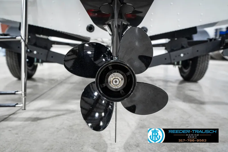 Slide: The Image of 2025 Lund 1775 Renegade boat propeller close-up in showroom setting. - 44