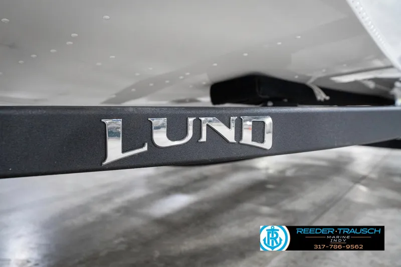 Slide: The Image of 2025 Lund 1775 Renegade boat trailer with logo, displayed at Reeder Trausch Marine. - 47
