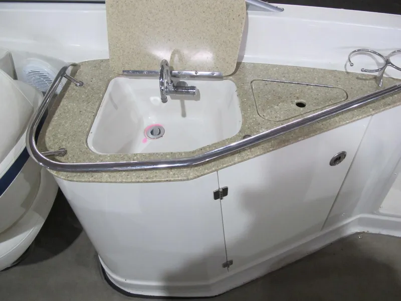 Slide: The Image of 2012 Monterey 264FS boat sink with faucet and countertop. - 13