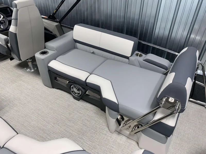 Slide: The Image of 2025 Avalon Catalina 2385 QLS Tritoon interior with gray seating and cup holders. - 4