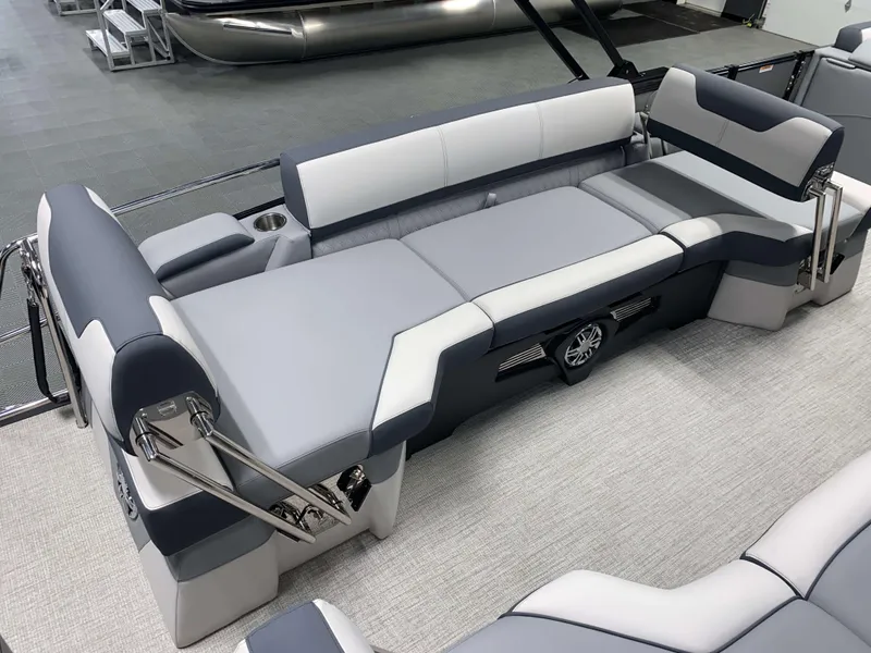 Slide: The Image of 2025 Avalon Catalina 2385 QLS Tritoon interior with sleek gray seating and modern design. - 5