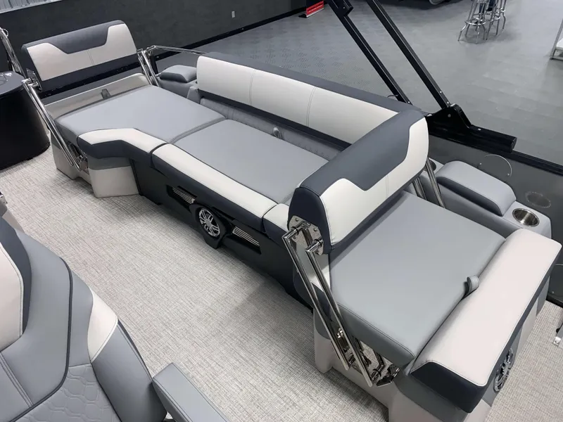 Slide: The Image of 2025 Avalon Catalina 2385 QLS Tritoon interior with luxurious seating and modern design. - 6