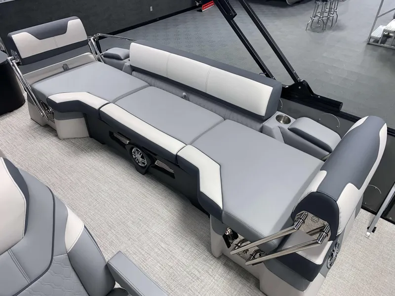 Slide: The Image of 2025 Avalon Catalina 2385 QLS Tritoon interior with luxurious gray seating and modern design. - 7