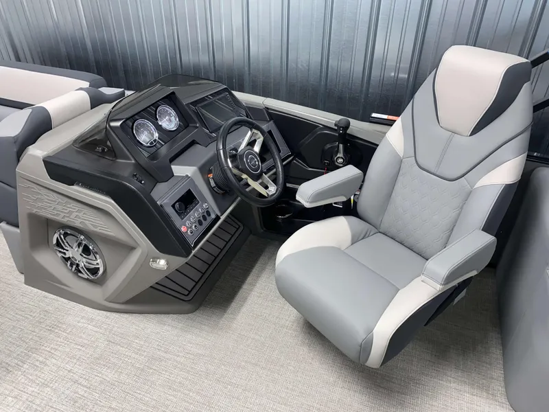 Slide: The Image of 2025 Avalon Catalina 2385 QLS Tritoon helm with modern steering and comfortable captain's chair. - 8