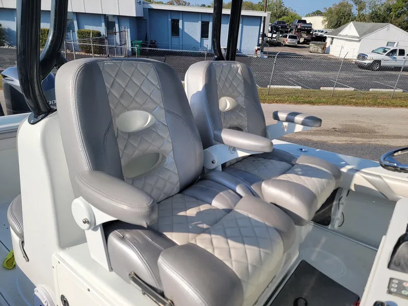 Slide: The Image of 2014 Yellowfin 36 boat with luxurious quilted seats, docked outdoors. - 15