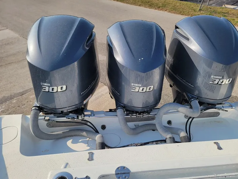 Slide: The Image of Triple Yamaha 300 outboard engines on a 2014 Yellowfin 36 boat. - 19