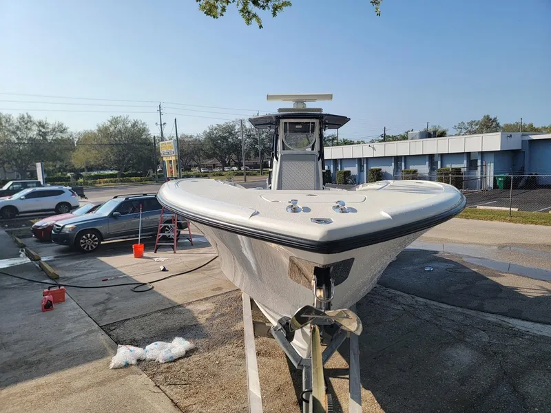 Slide: The Image of 2014 Yellowfin 36 boat on trailer in parking lot, clear day. - 2