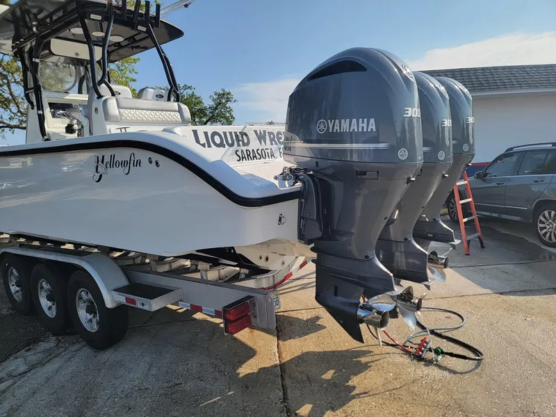 Slide: The Image of 2014 Yellowfin 36 boat with triple Yamaha 300 engines on a trailer. - 20