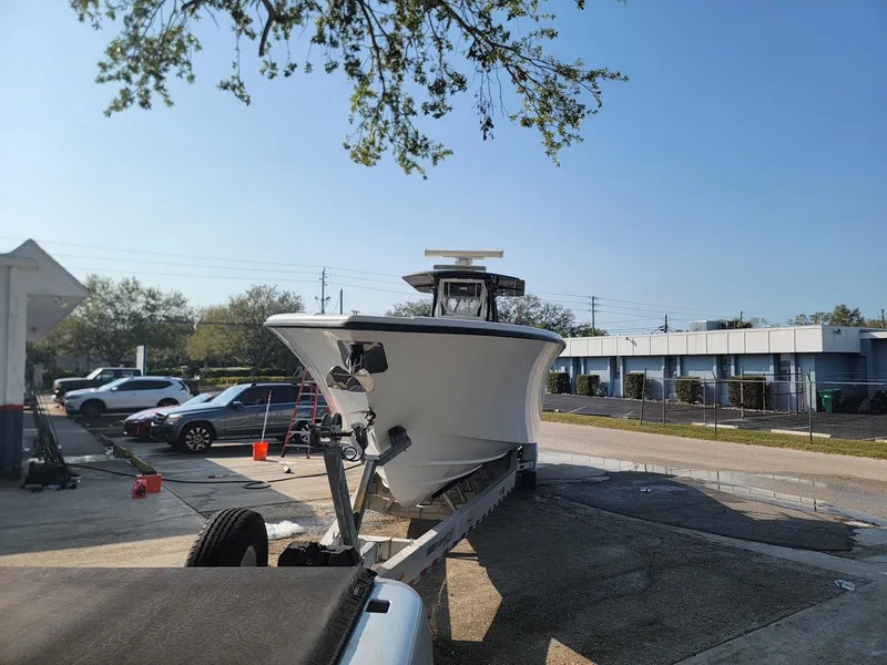 Slide: The Image of 2014 Yellowfin 36 boat on trailer in outdoor setting. - 3