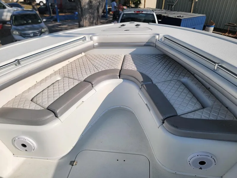 Slide: The Image of 2014 Yellowfin 36 boat with cushioned seating and spacious deck area. - 5