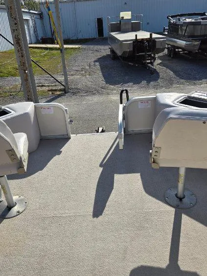 Slide: The Image of 2004 SunCatcher G3 22C pontoon boat interior with seating and open deck view. - 11