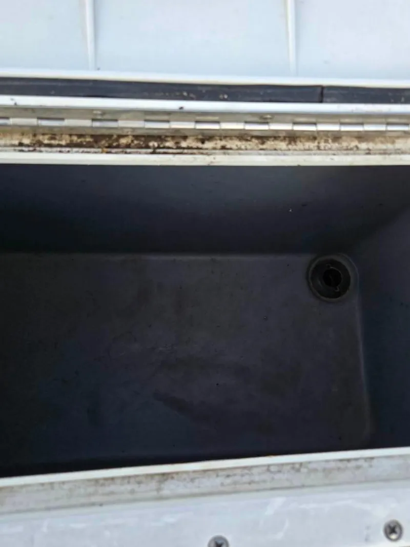 Slide: The Image of Open storage compartment of 2004 SunCatcher G3 22C boat. - 12