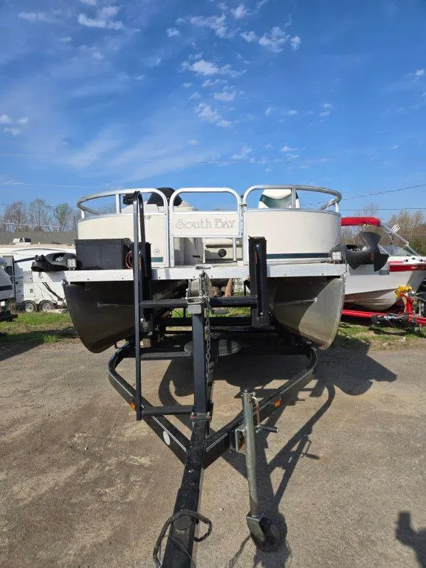 Slide: The Image of 2004 SunCatcher G3 22C pontoon boat on trailer under clear blue sky. - 8