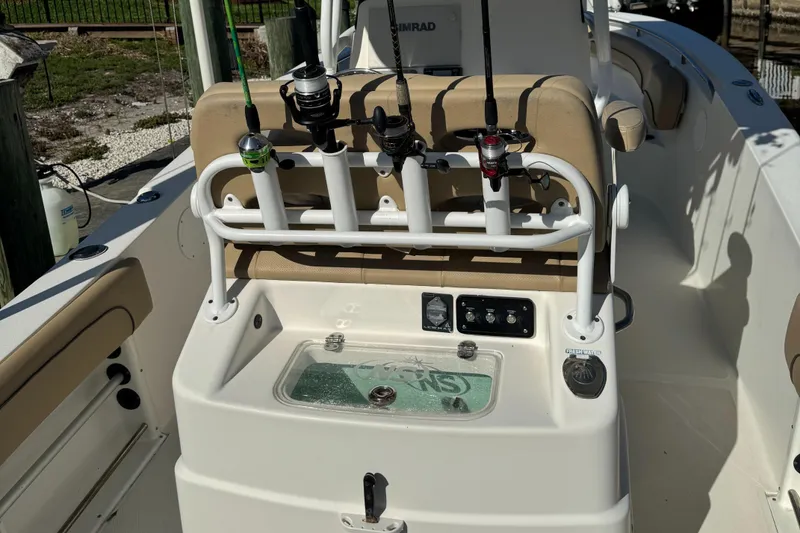 Slide: The Image of 2019 NauticStar 25XS boat with fishing rod holders and control panel. - 4