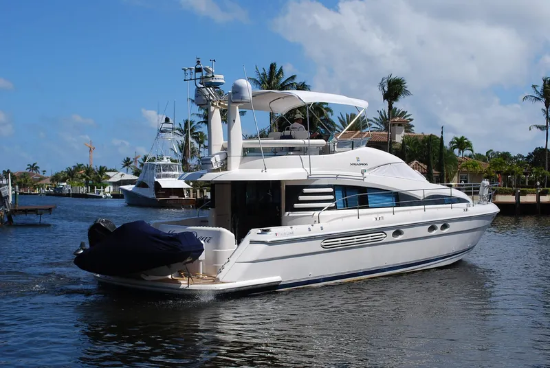 Slide: The Image of Luxury 2000 Fairline Squadron yacht cruising on a sunny day. - 2