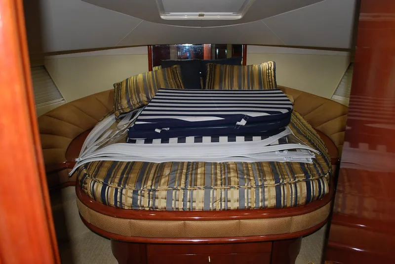 Slide: The Image of Luxurious cabin interior of 2000 Fairline Squadron yacht with striped bedding. - 27