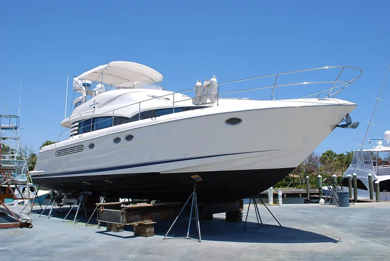 Slide: The Image of Fairline Squadron 2000 yacht on dry dock under clear blue sky. - 34