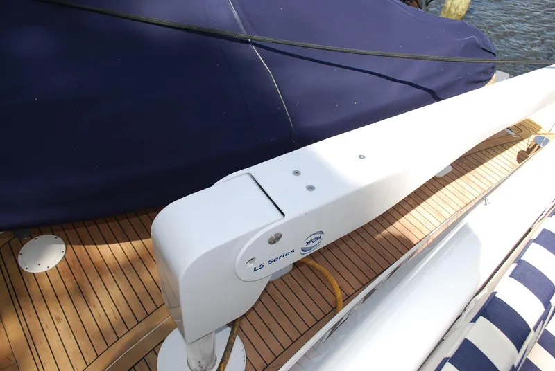 Slide: The Image of 2000 Fairline Squadron yacht deck with wooden flooring and covered seating area. - 38