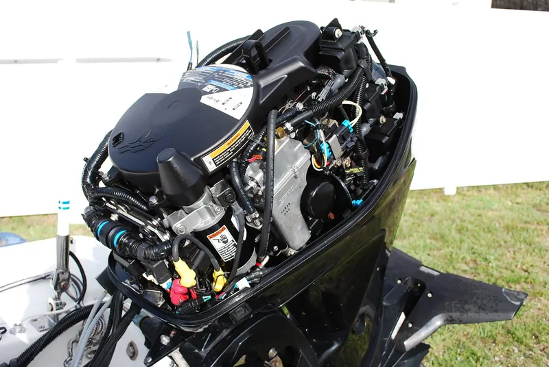 Slide: The Image of Open engine of a 2000 Fairline Squadron boat, showcasing intricate mechanical components. - 42