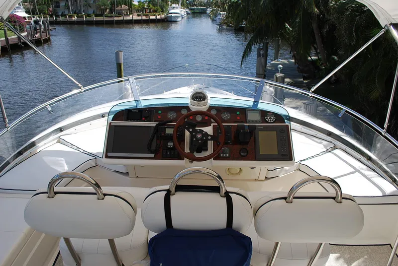 Slide: The Image of Cockpit view of 2000 Fairline Squadron yacht with steering wheel and control panel. - 5